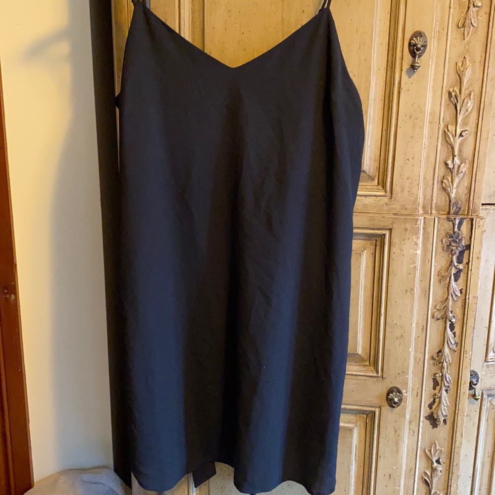 Simple black poly slip dress tie in back